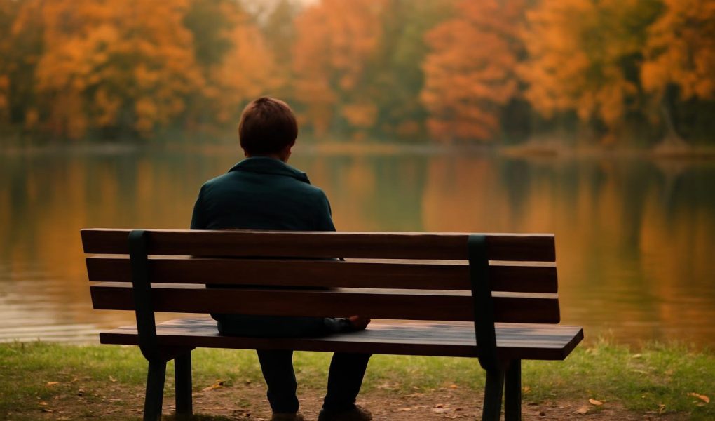 personne-banc-parc-lac-automne