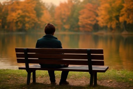personne-banc-parc-lac-automne